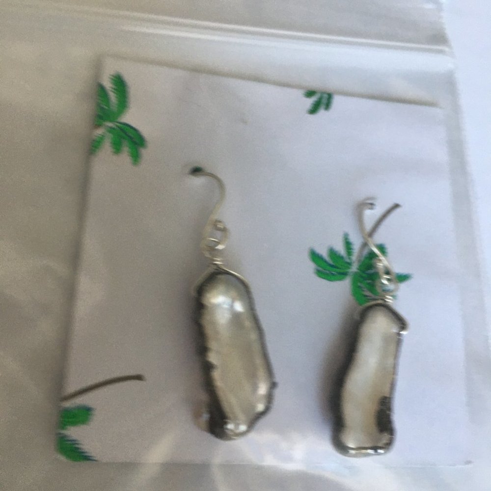 pearl earrings in silver encasements